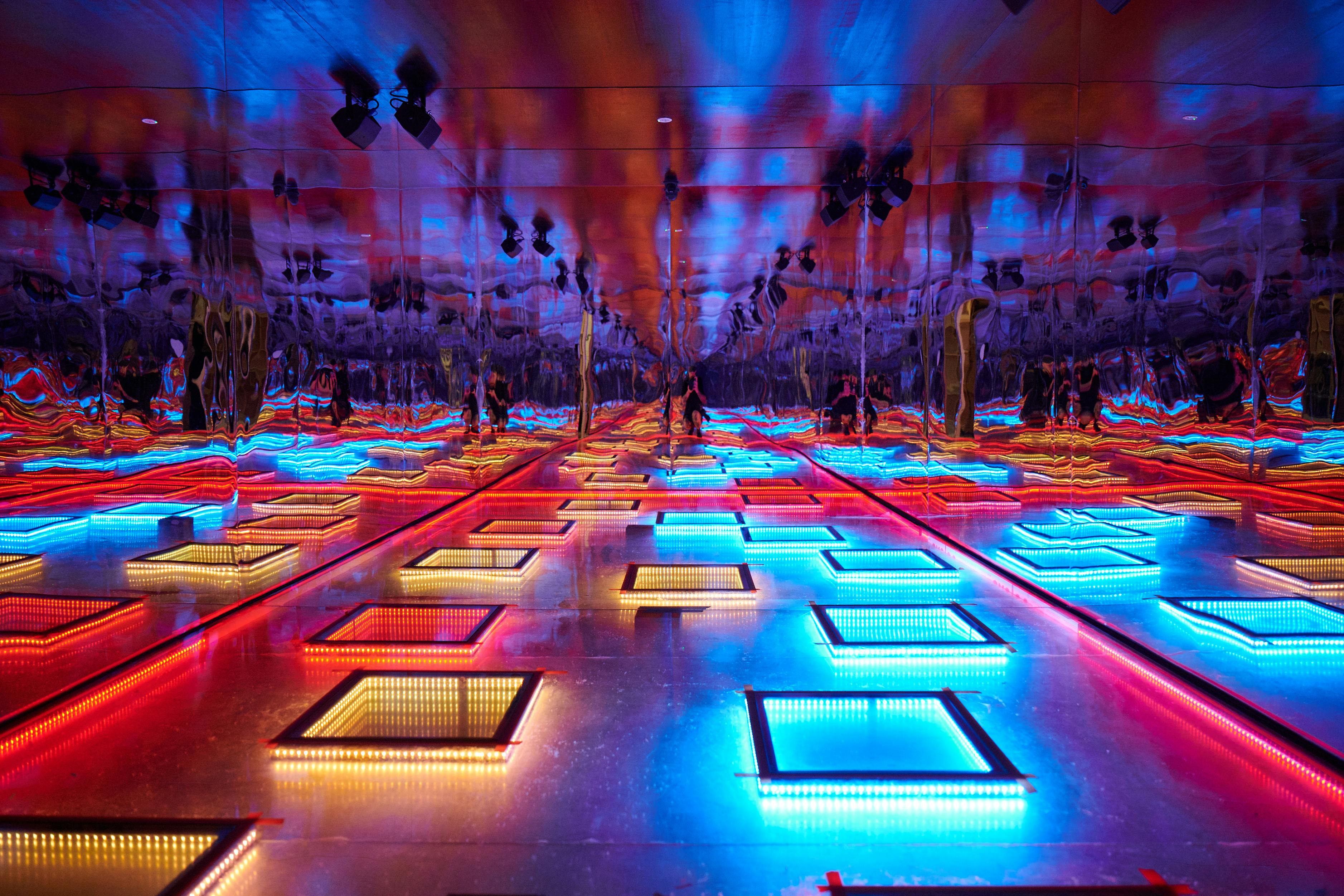 Light filled squares spread across the ground as part of an art exhibition at Uptown Brisbane