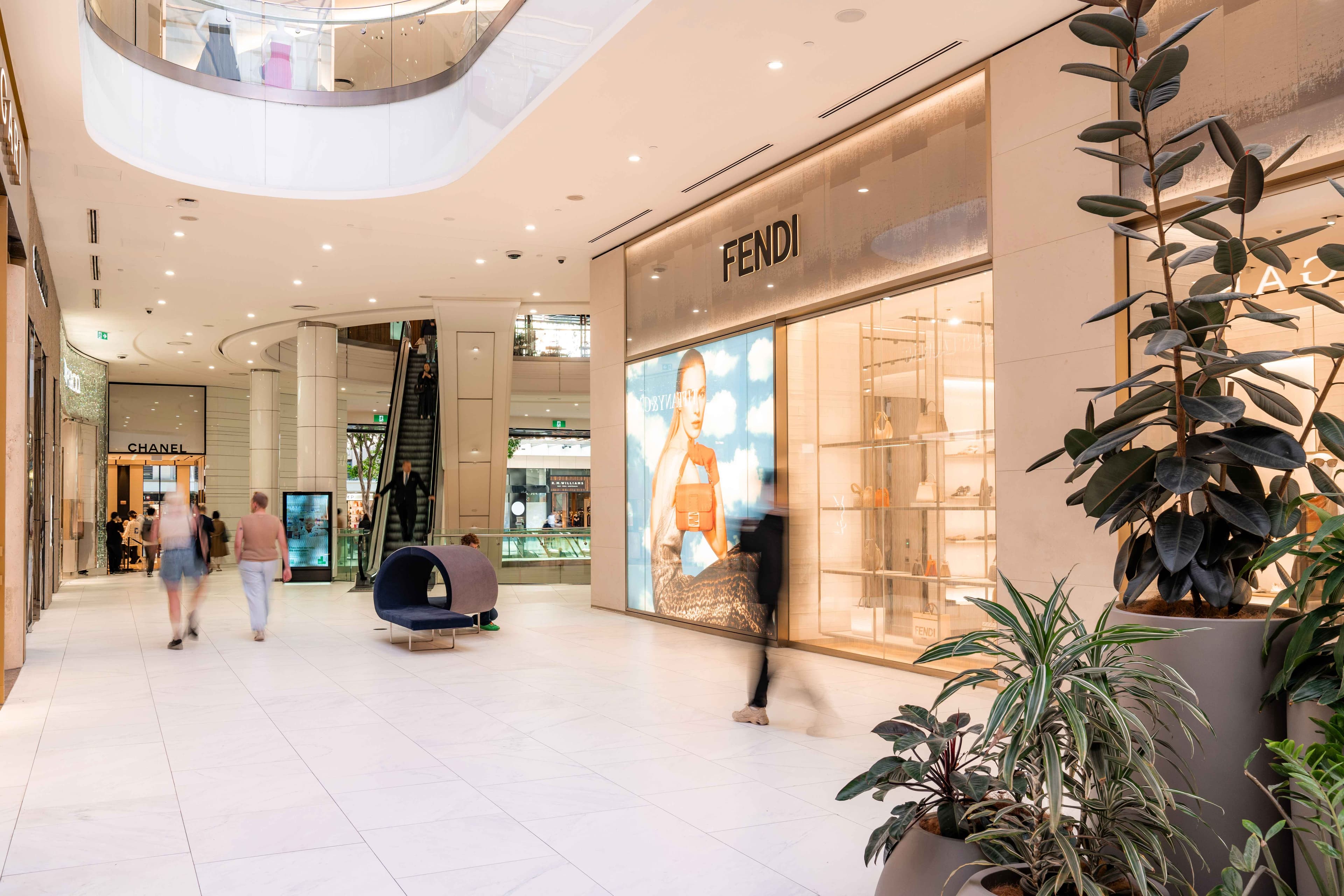 People walking through luxury precinct